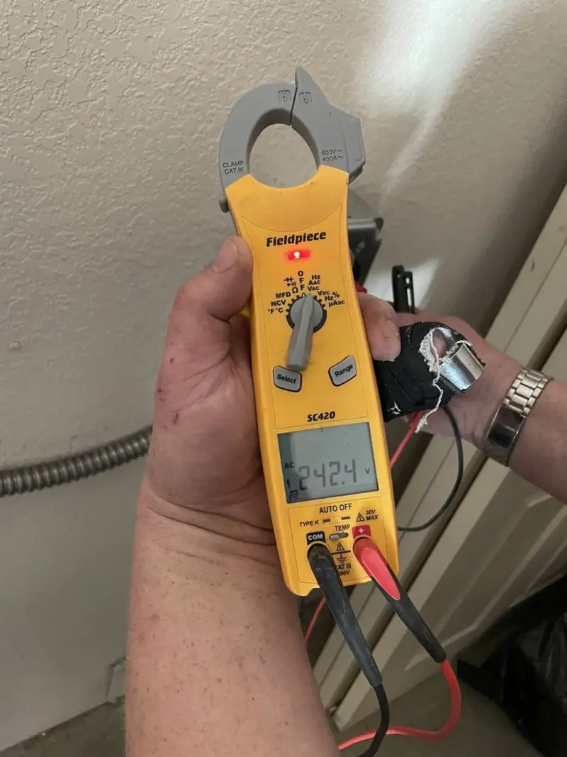 Voltage testing with clamp meter during Generator Installation in Lake St. Louis